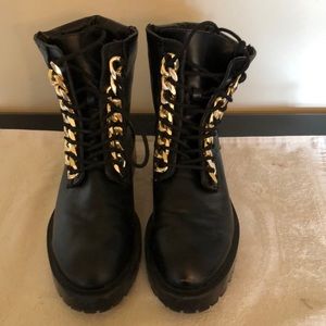 Chunky sole black boots with gold chain detail